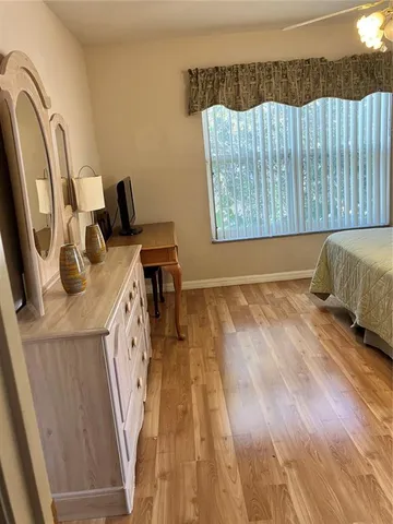 a kitchen with stainless steel appliances granite countertop a refrigerator a sink a stove and dishwasher