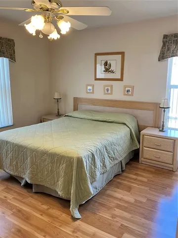 a kitchen with stainless steel appliances granite countertop a sink a stove and cabinets