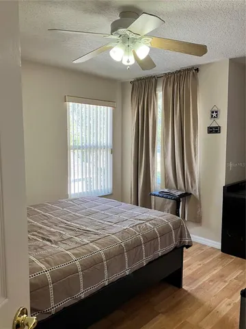 a view of balcony with wooden floor and plant