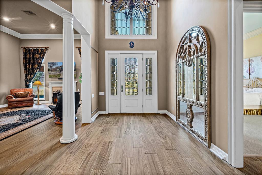 8908 Brierfield Road Granbury, TX 76049 - Photo 5 of 40 a view of an entryway with wooden floor