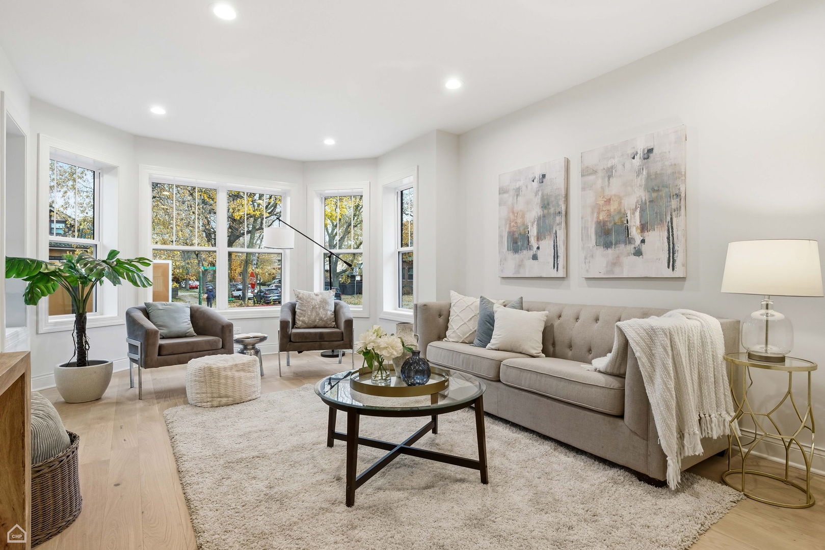 Undisclosed Address Chicago, IL 60625 - Photo 2 of 36 a living room with furniture and a large window