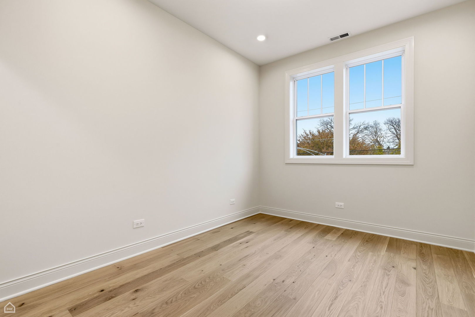 Undisclosed Address Chicago, IL 60625 - Photo 27 of 36 an empty room with wooden floor and window