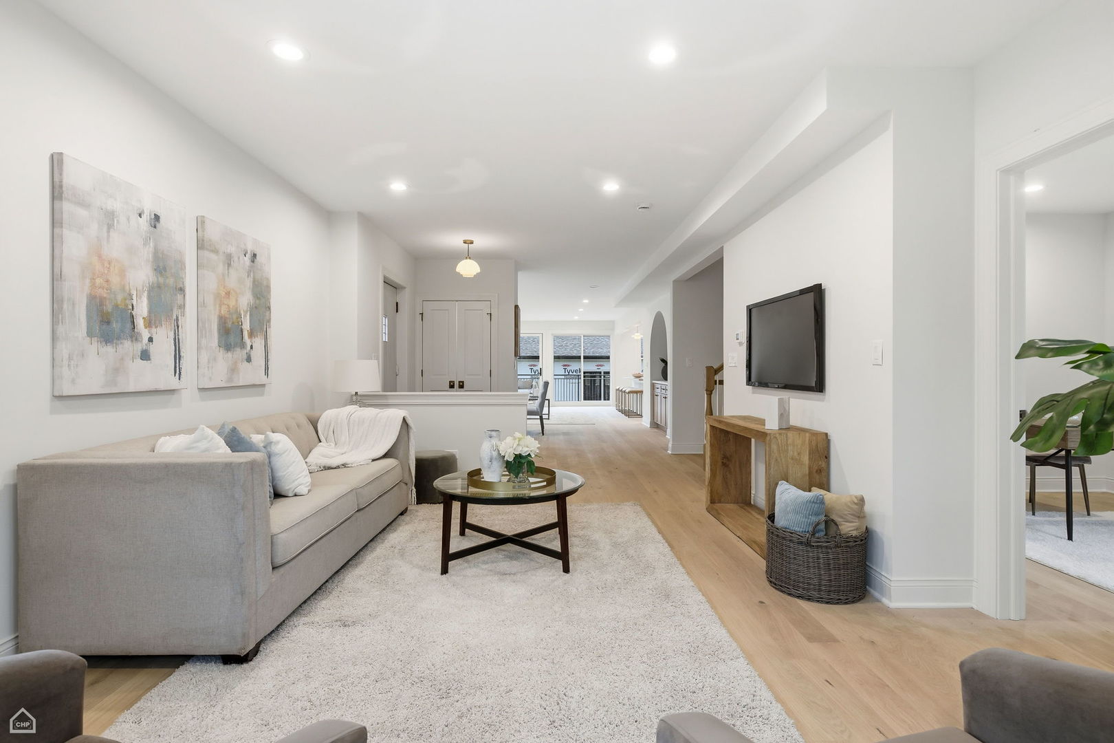 Undisclosed Address Chicago, IL 60625 - Photo 3 of 36 a living room with furniture and a flat screen tv