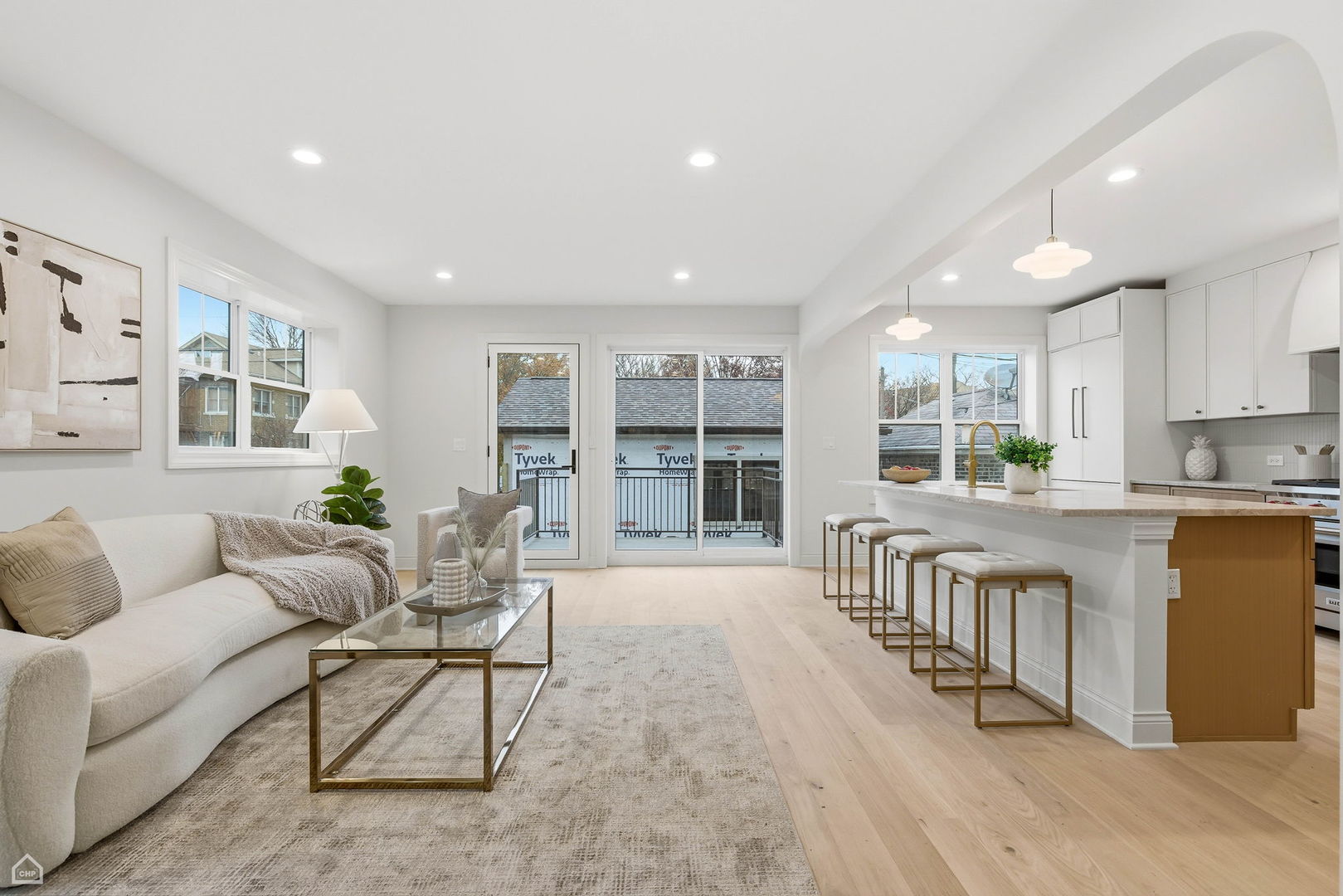 Undisclosed Address Chicago, IL 60625 - Photo 9 of 36 a living room with furniture a wooden floor and a window