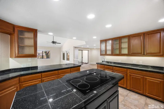 a kitchen with stainless steel appliances granite countertop a stove and a sink