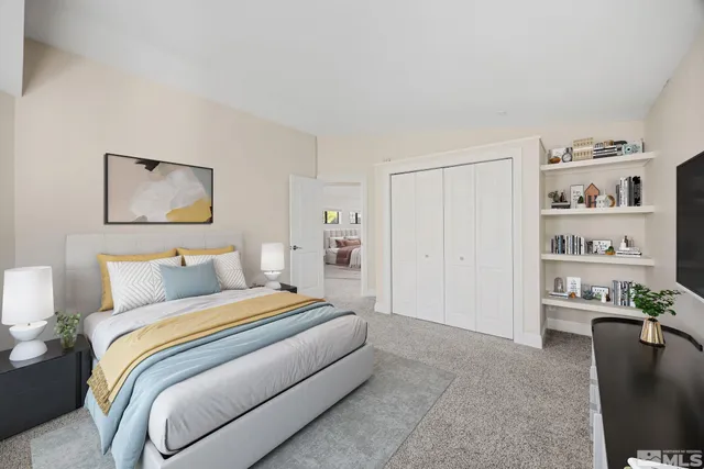 a bedroom with a bed furniture and decor