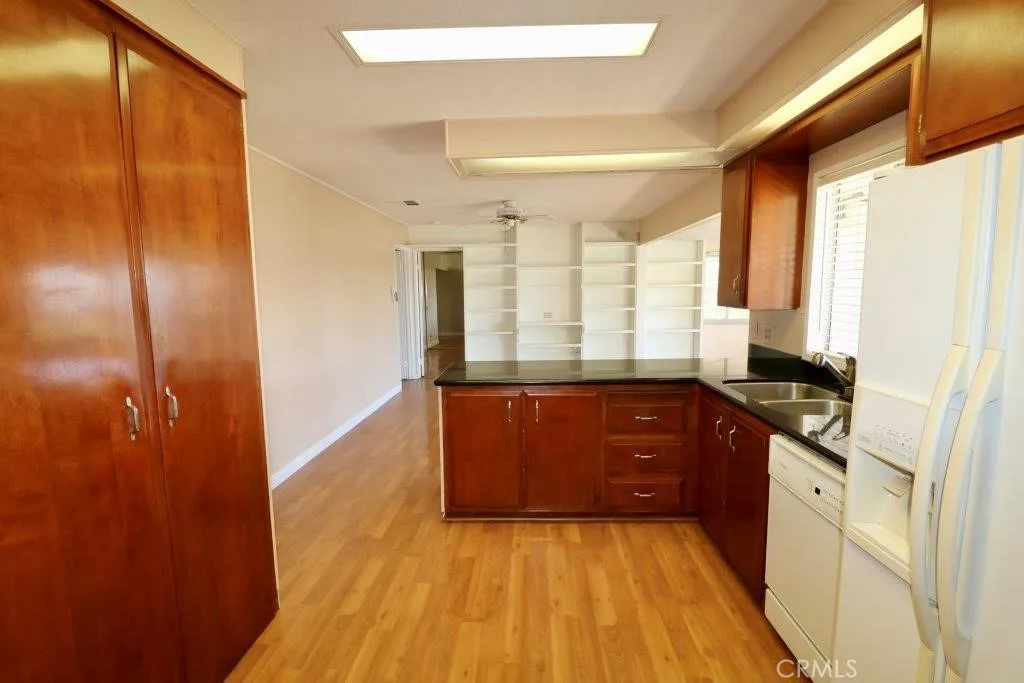 16901 Pleasant Way, Unit 231 Yorba Linda, CA 92886 - Photo 24 of 43 a kitchen with stainless steel appliances granite countertop a refrigerator and a sink