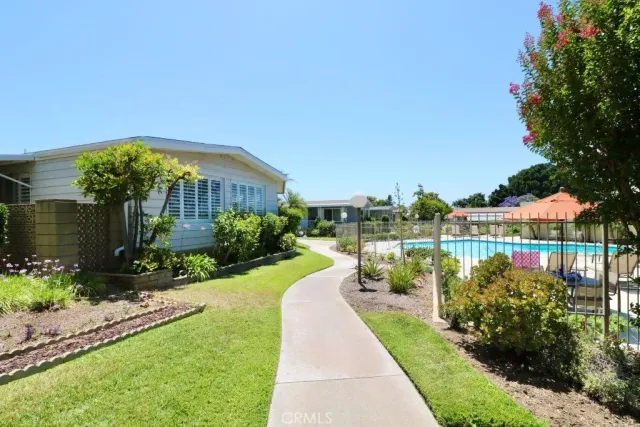 a view of a garden with a lake view