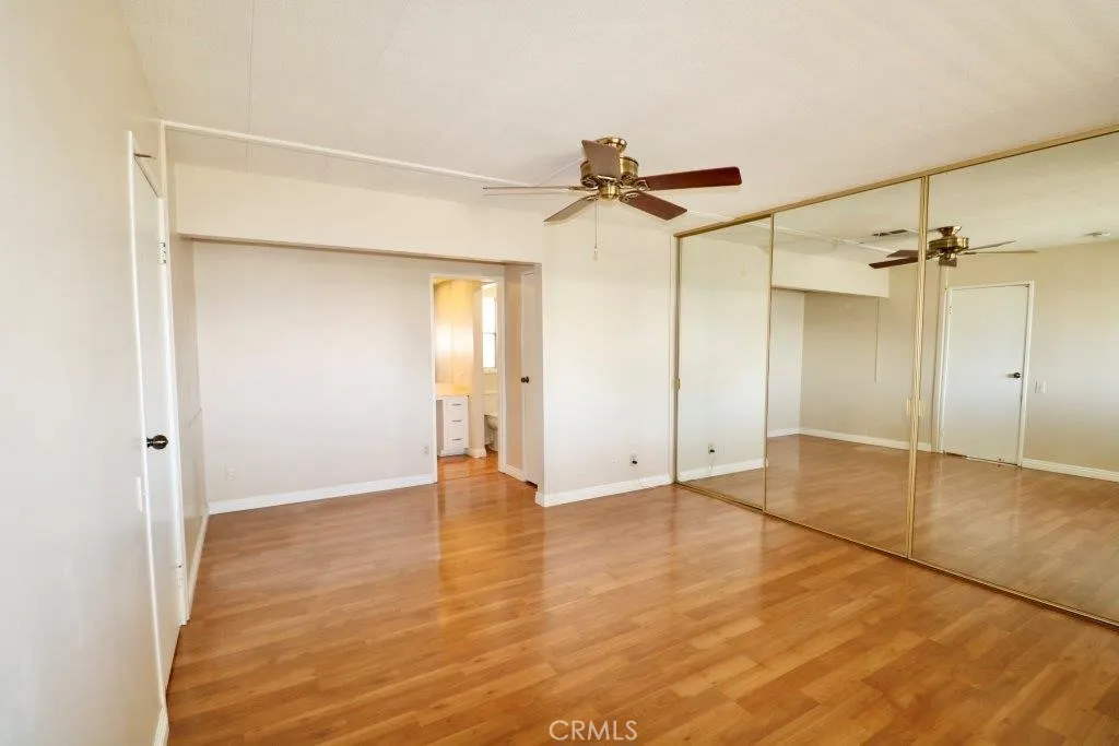 16901 Pleasant Way, Unit 231 Yorba Linda, CA 92886 - Photo 33 of 43 wooden floor in an empty room with a window