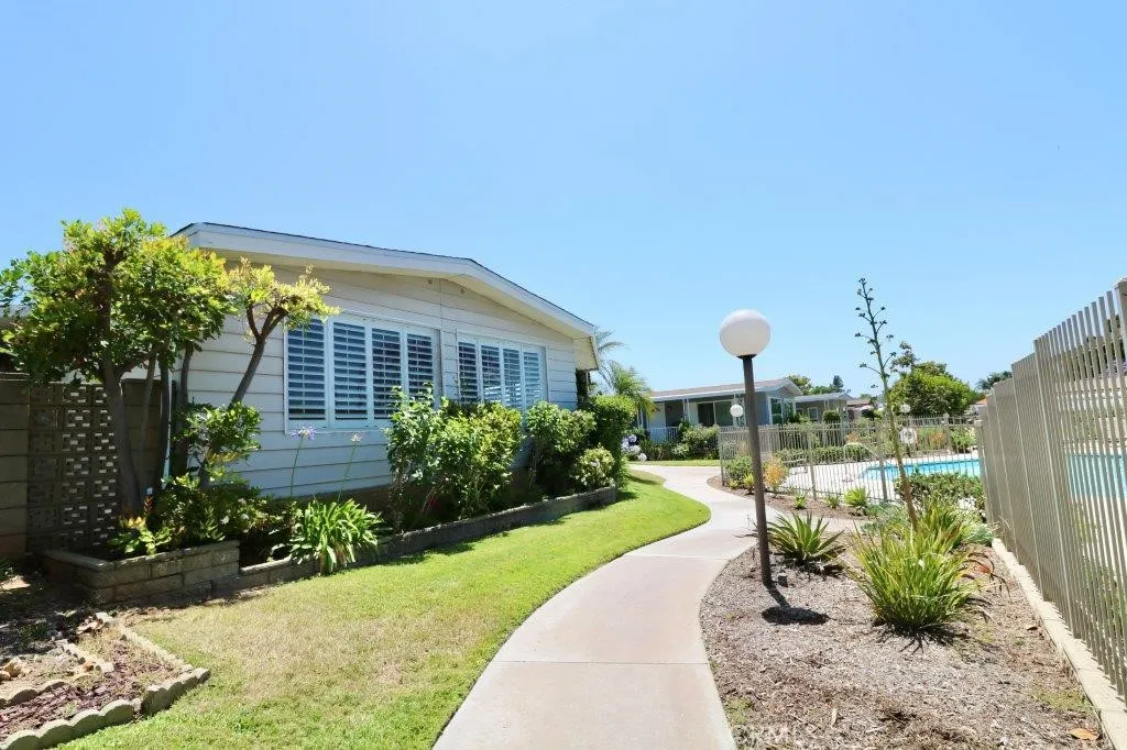 16901 Pleasant Way, Unit 231 Yorba Linda, CA 92886 - Photo 4 of 43 a view of a garden with a building in the background