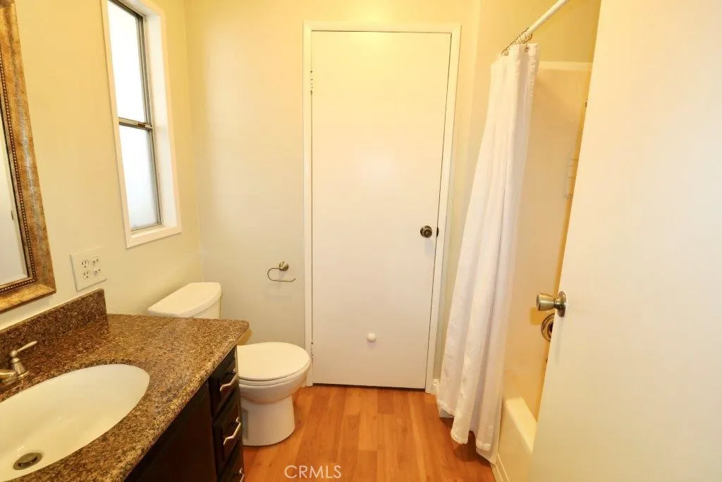 16901 Pleasant Way, Unit 231 Yorba Linda, CA 92886 - Photo 43 of 43 a bathroom with a granite countertop sink toilet and shower