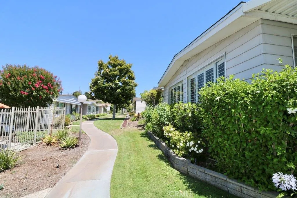16901 Pleasant Way, Unit 231 Yorba Linda, CA 92886 - Photo 5 of 43 a front view of a house with a yard