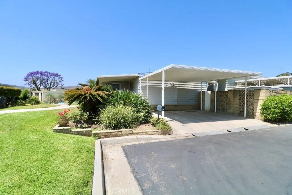 16901 Pleasant Way, Unit 231 Yorba Linda, CA 92886 - Photo 10 of 43 front view of a house with a yard