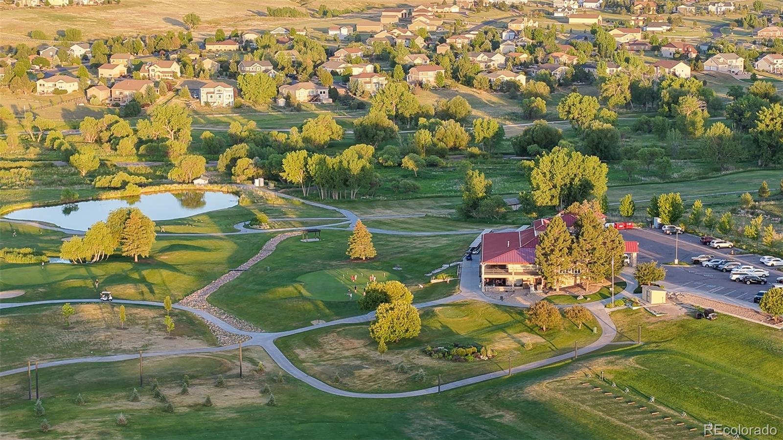 41865 East Muirfield Loop Elizabeth, CO 80107 - Photo 44 of 50 an aerial view of a house with swimming pool yard and lake view