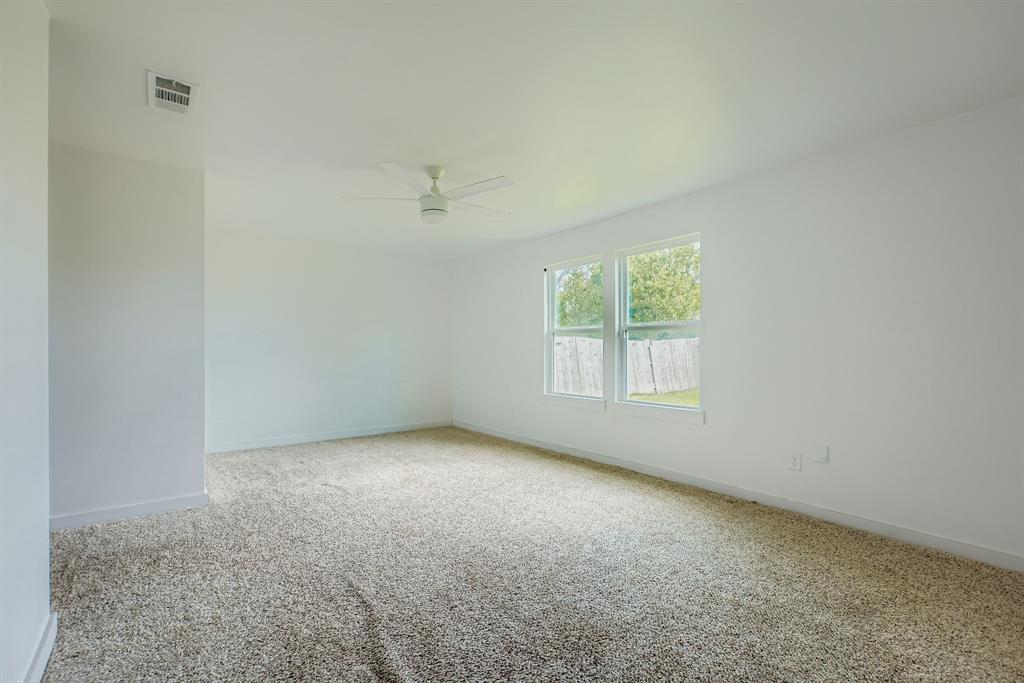 304 Thomas Street Terrell, TX 75160 - Photo 12 of 12 an empty room with a window
