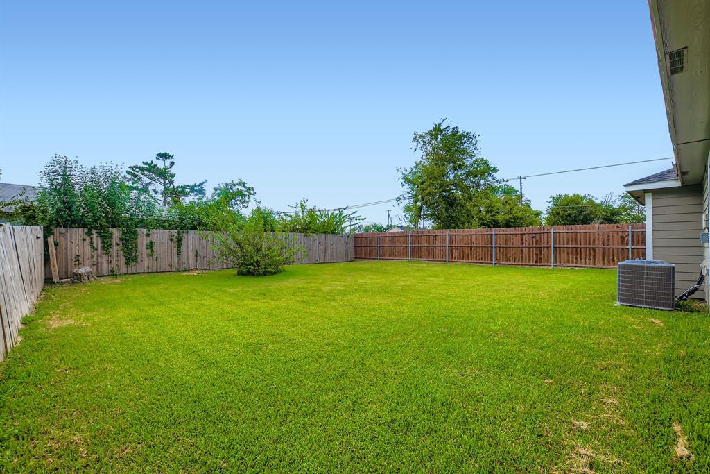 304 Thomas Street Terrell, TX 75160 - Photo 4 of 12 a view of yard with green space and wooden fence