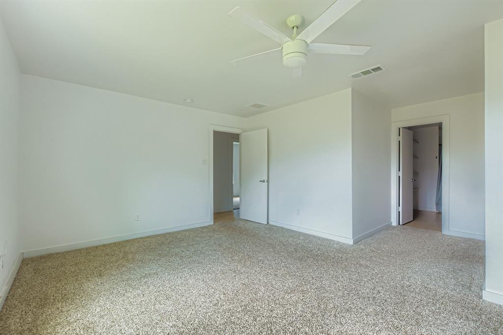304 Thomas Street Terrell, TX 75160 - Photo 9 of 12 a view of an empty room and a ceiling fan
