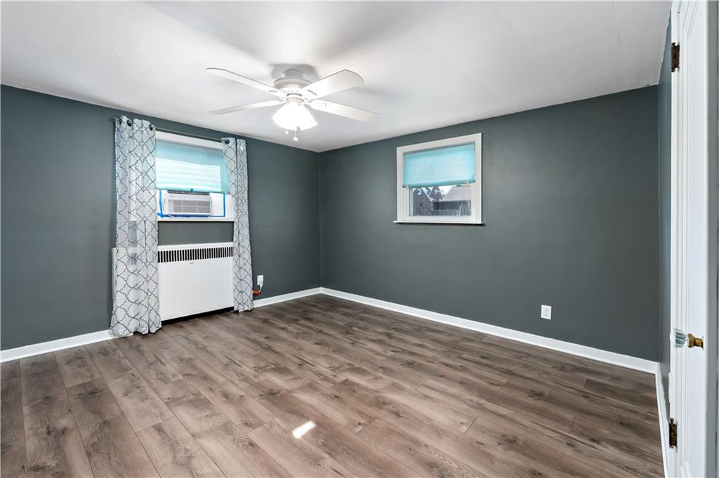 425 MacArthur Street McKees Rocks, PA 15136 - Photo 11 of 25 a view of an empty room with wooden floor and a window