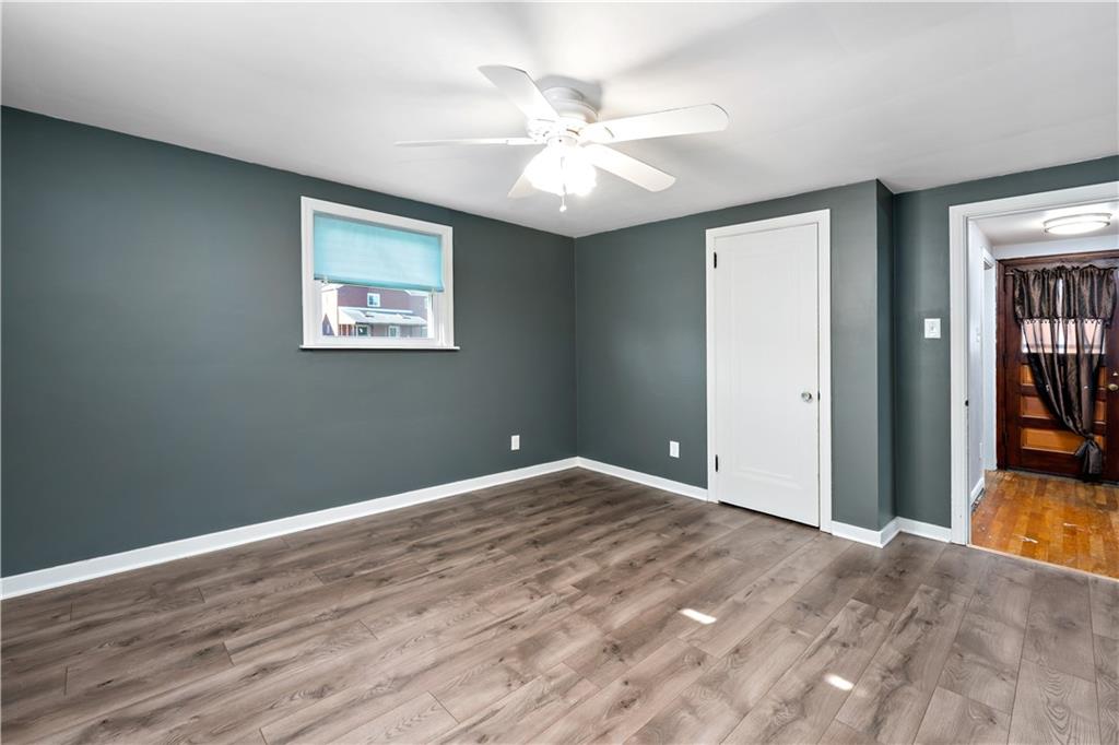 425 MacArthur Street McKees Rocks, PA 15136 - Photo 12 of 25 a view of an empty room with wooden floor