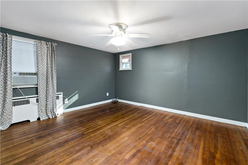 425 MacArthur Street McKees Rocks, PA 15136 - Photo 14 of 25 wooden floor in an empty room with a window