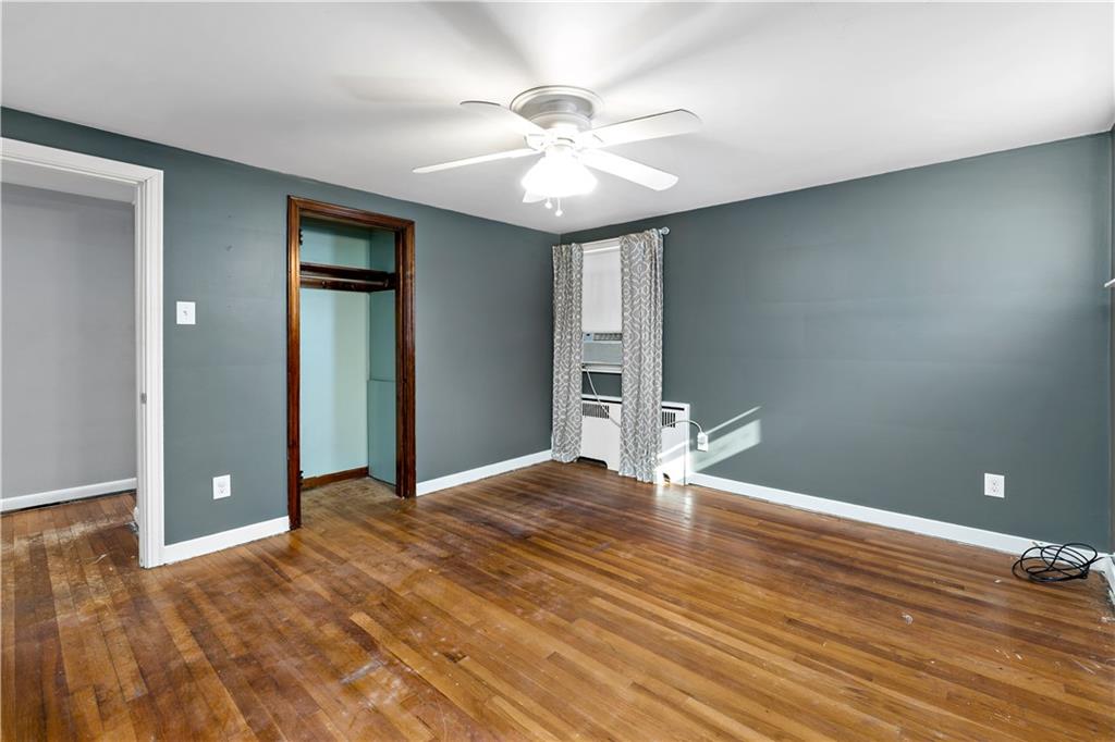 425 MacArthur Street McKees Rocks, PA 15136 - Photo 15 of 25 a view of an empty room with wooden floor