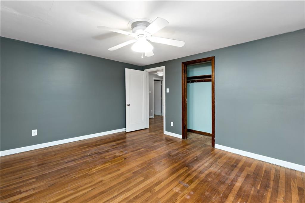 425 MacArthur Street McKees Rocks, PA 15136 - Photo 16 of 25 a view of an empty room with wooden floor