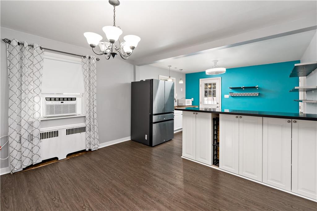 425 MacArthur Street McKees Rocks, PA 15136 - Photo 6 of 25 a kitchen with stainless steel appliances granite countertop a refrigerator a sink and a refrigerator