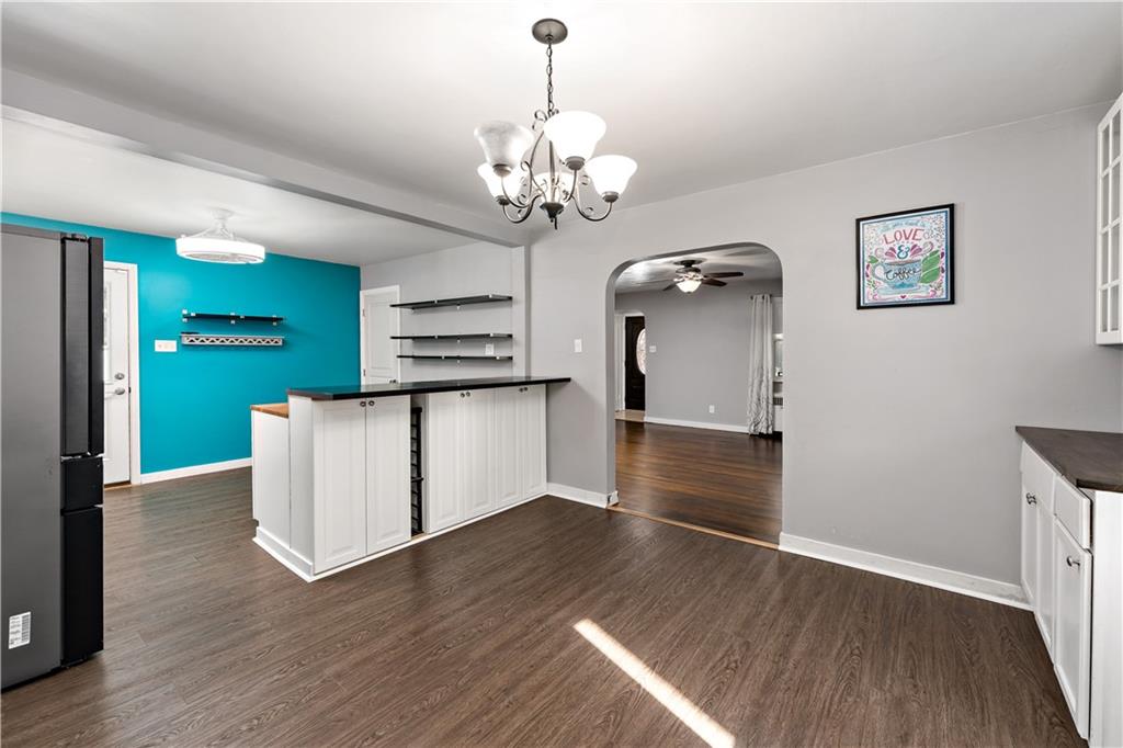 425 MacArthur Street McKees Rocks, PA 15136 - Photo 7 of 25 a view of a room with chandelier and wooden floor