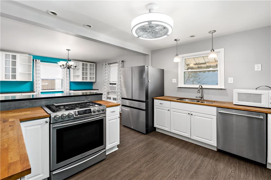 425 MacArthur Street McKees Rocks, PA 15136 - Photo 10 of 25 a kitchen with a stove and a refrigerator