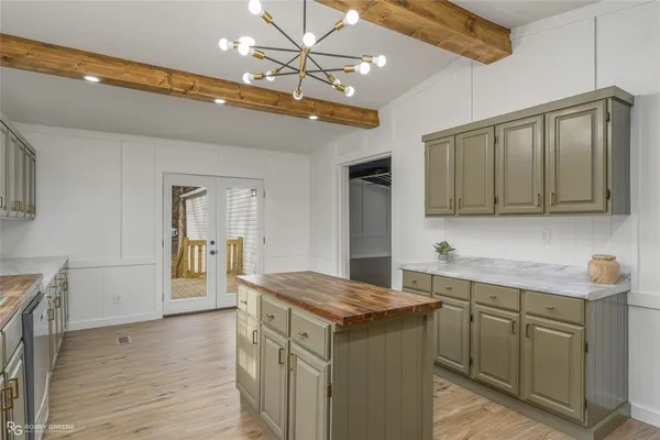 a kitchen with a sink and cabinets