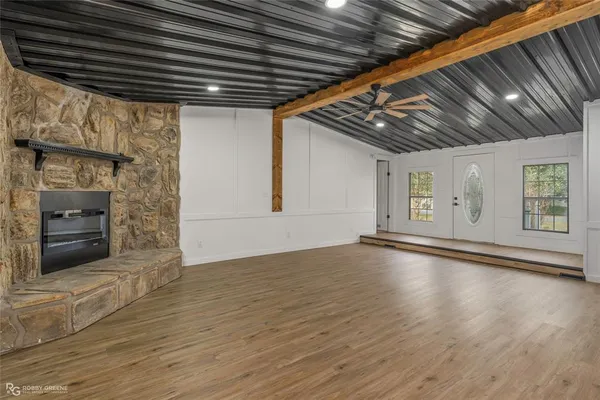 a view of an empty room with a fireplace