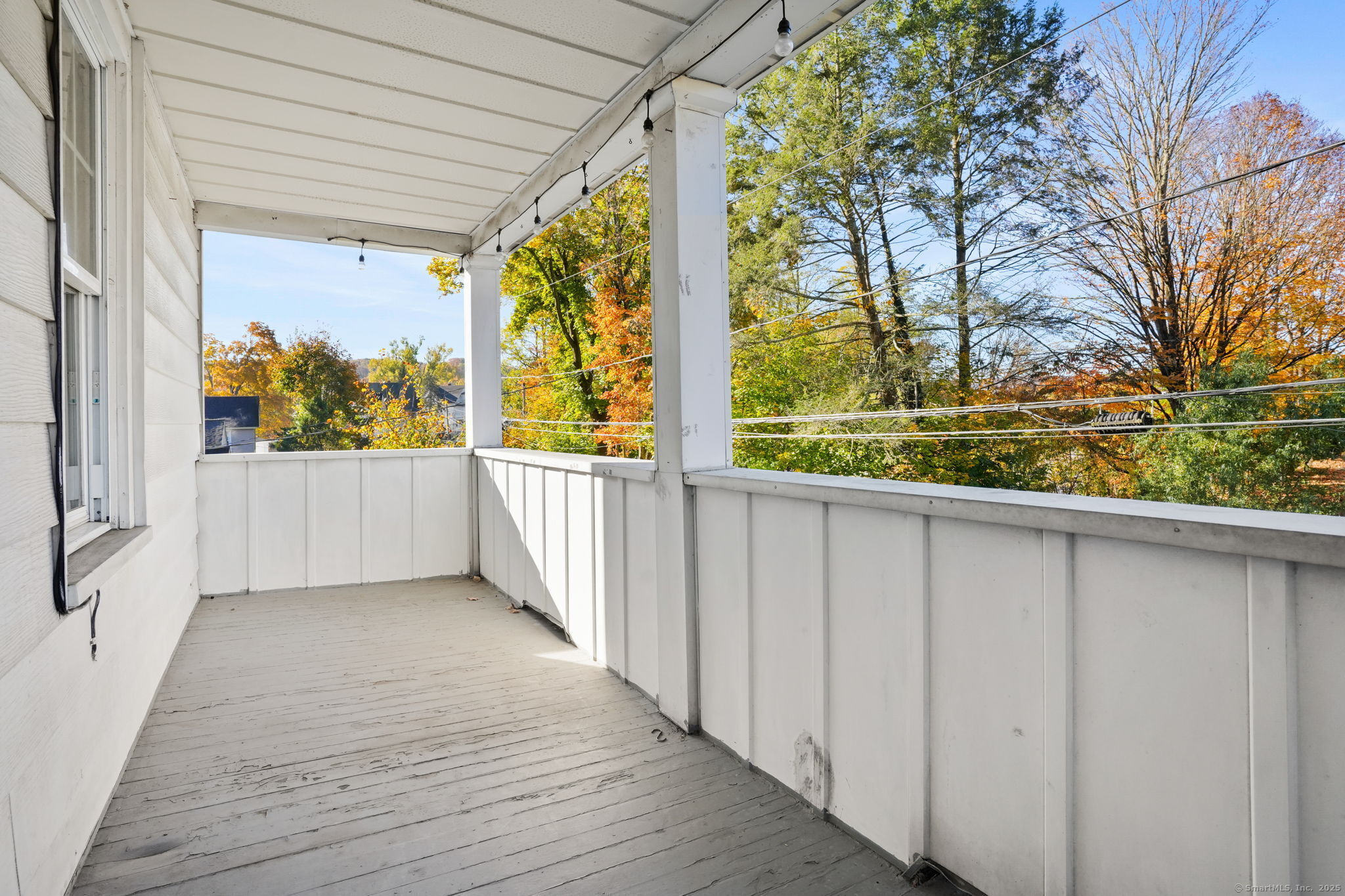 117 Golden Hill Street Naugatuck, CT 06770 - Photo 3 of 10 a view of balcony with wooden floor and fence