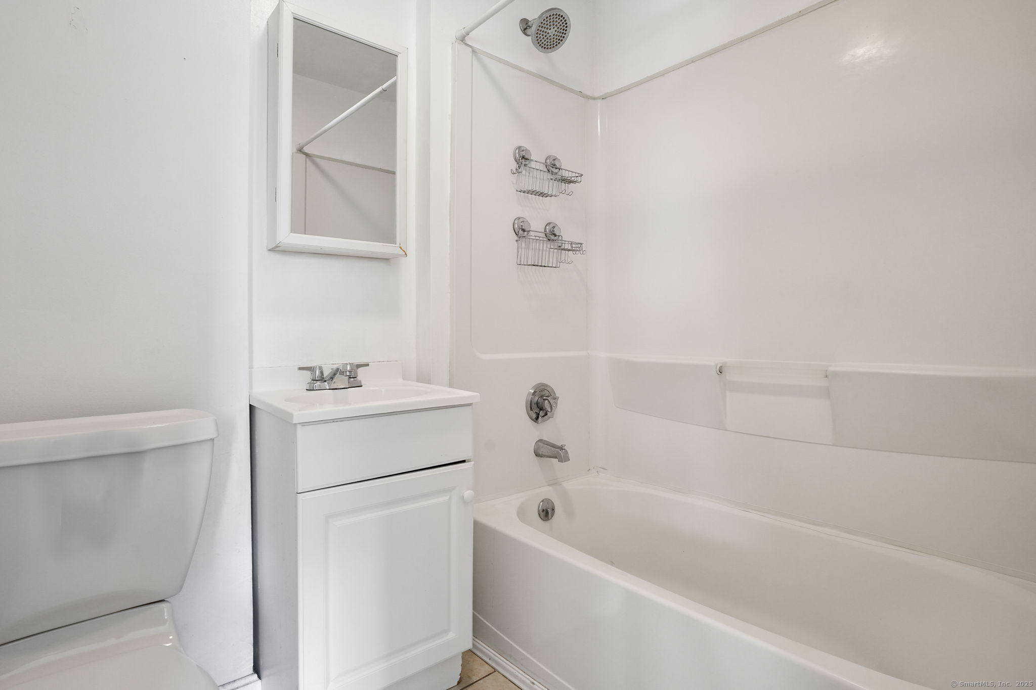 117 Golden Hill Street Naugatuck, CT 06770 - Photo 4 of 10 a bathroom with a bathtub and a shower