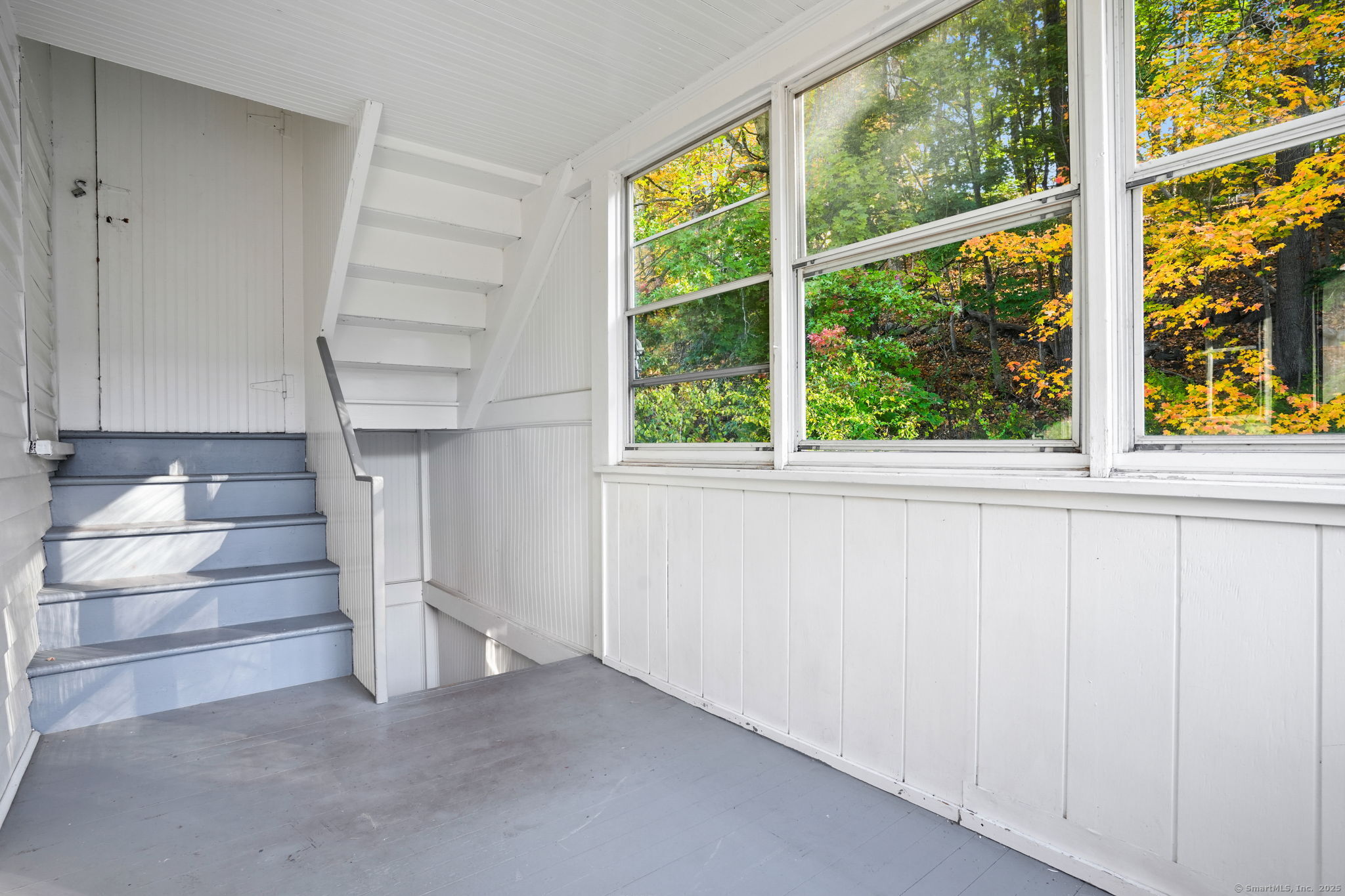 117 Golden Hill Street Naugatuck, CT 06770 - Photo 7 of 10 a view of an empty room with stairs