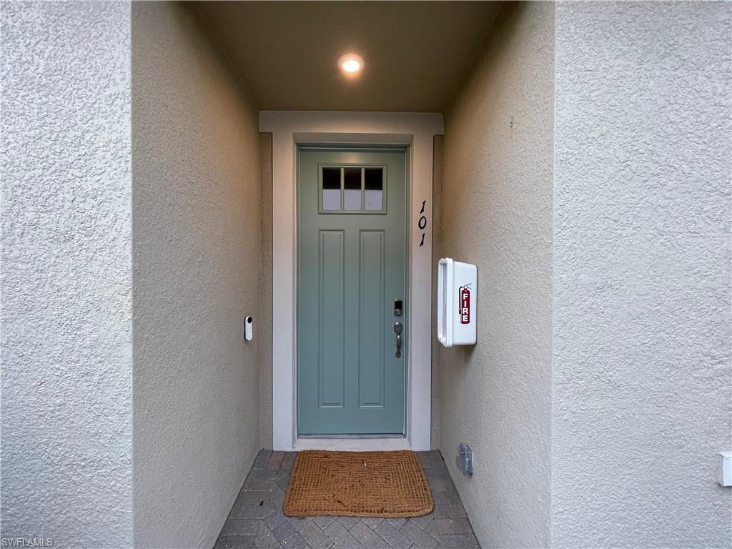 4676 Arboretum Circle, Unit 101 Naples, FL 34112 - Photo 24 of 24 a view of hallway with elevator