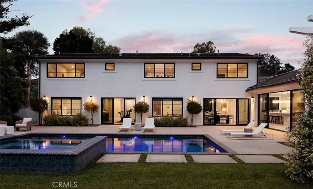a front view of houses with yard