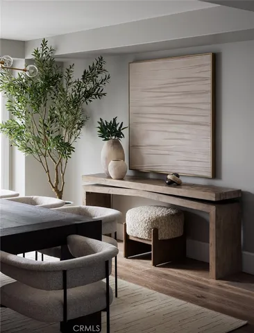 a kitchen with stainless steel appliances kitchen island granite countertop a stove a sink and a white cabinets