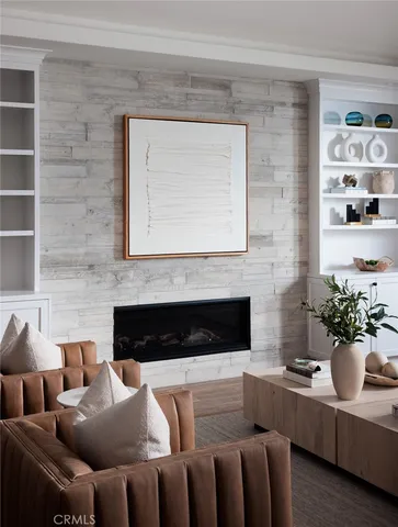 a kitchen with a table chairs microwave and cabinets