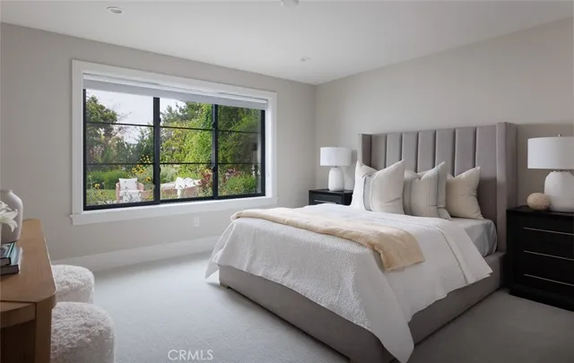 a bathroom with a granite countertop sink a toilet and a mirror