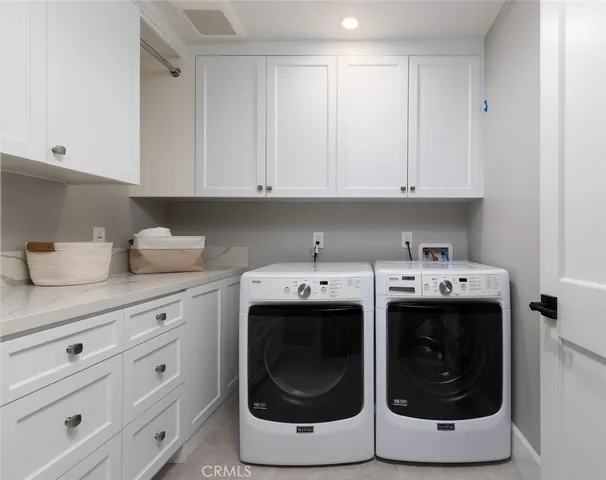 a bathroom with a potted plant and a sink