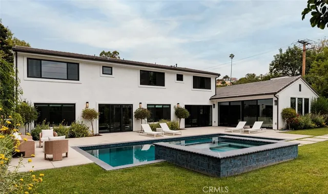 a view of a patio with couches and potted plants