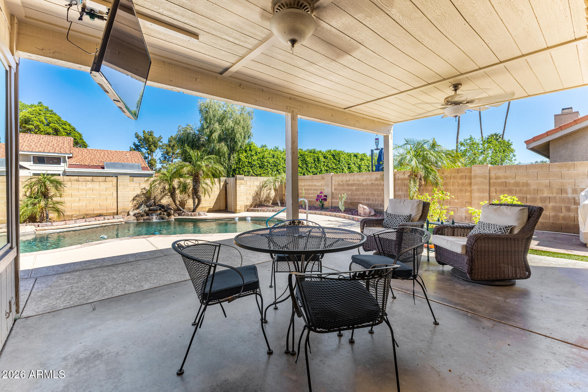1942 East Krista Way Tempe, AZ 85284 - Photo 35 of 51 a view of a patio with a table and chairs and potted plants