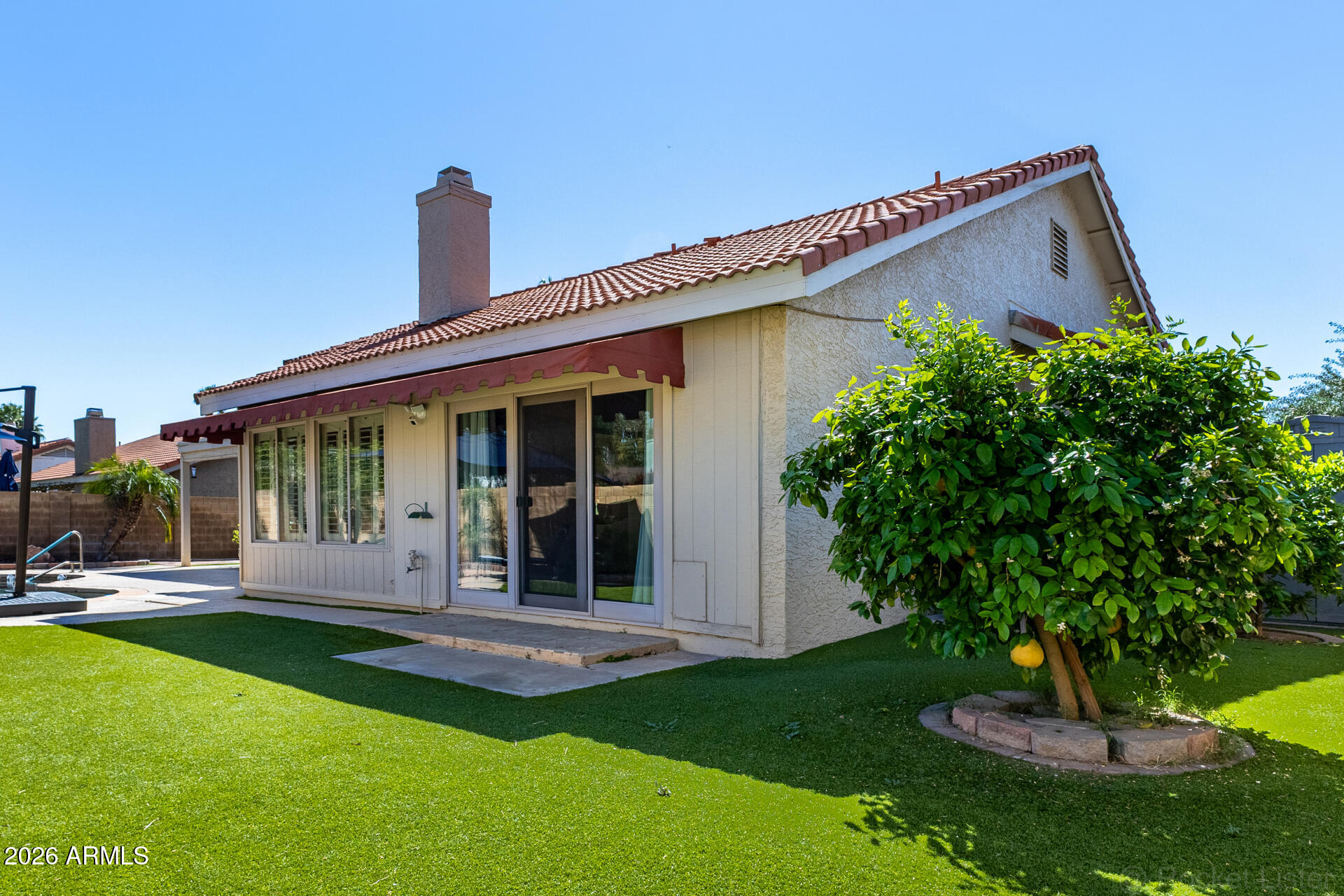 1942 East Krista Way Tempe, AZ 85284 - Photo 40 of 51 a front view of a house with a yard garage and outdoor seating