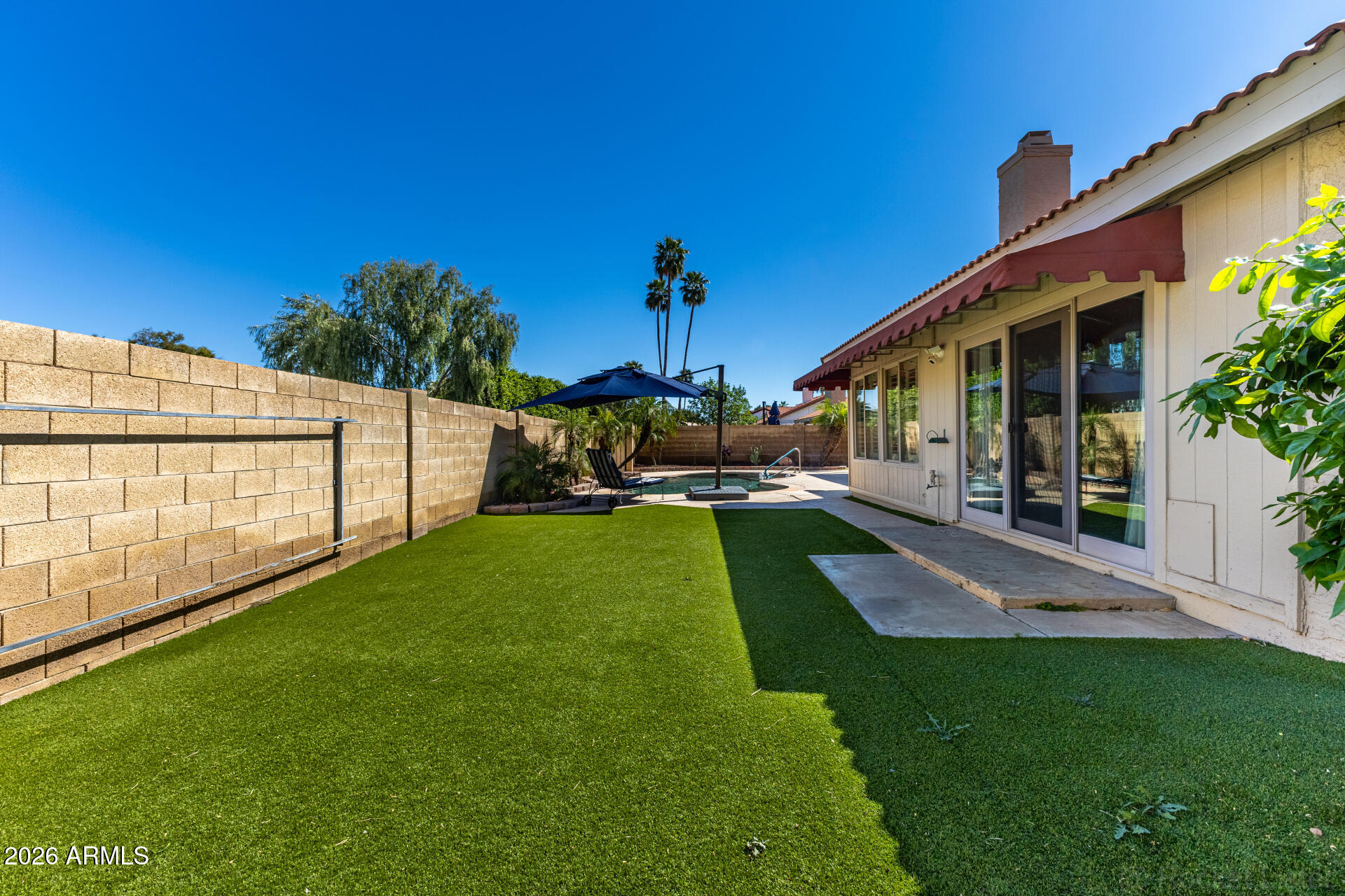 1942 East Krista Way Tempe, AZ 85284 - Photo 41 of 51 a view of a backyard with swimming pool