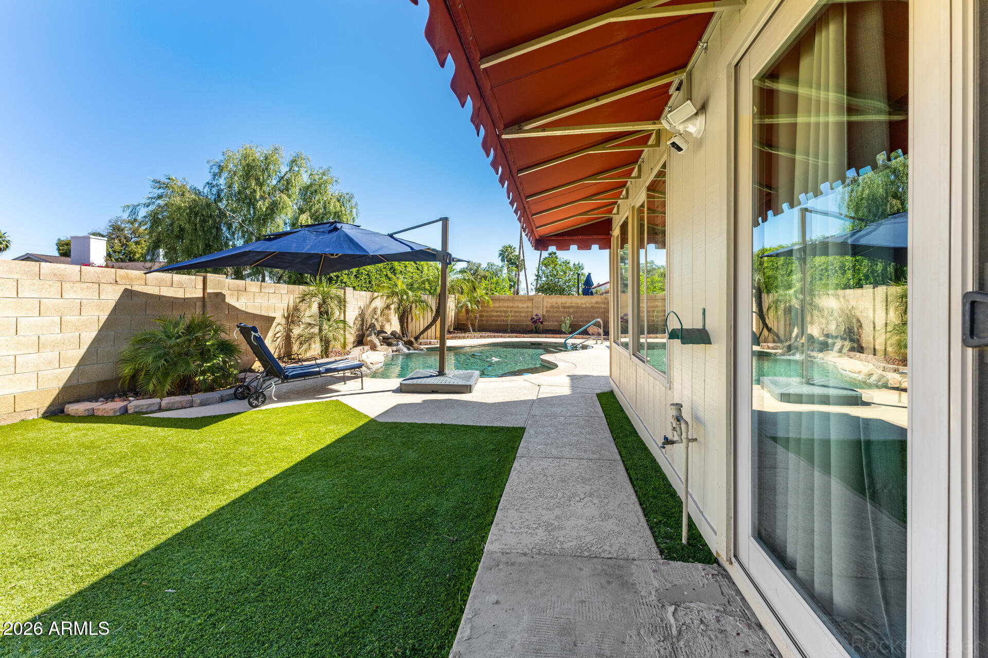 1942 East Krista Way Tempe, AZ 85284 - Photo 42 of 51 a view of a patio with a table and chairs