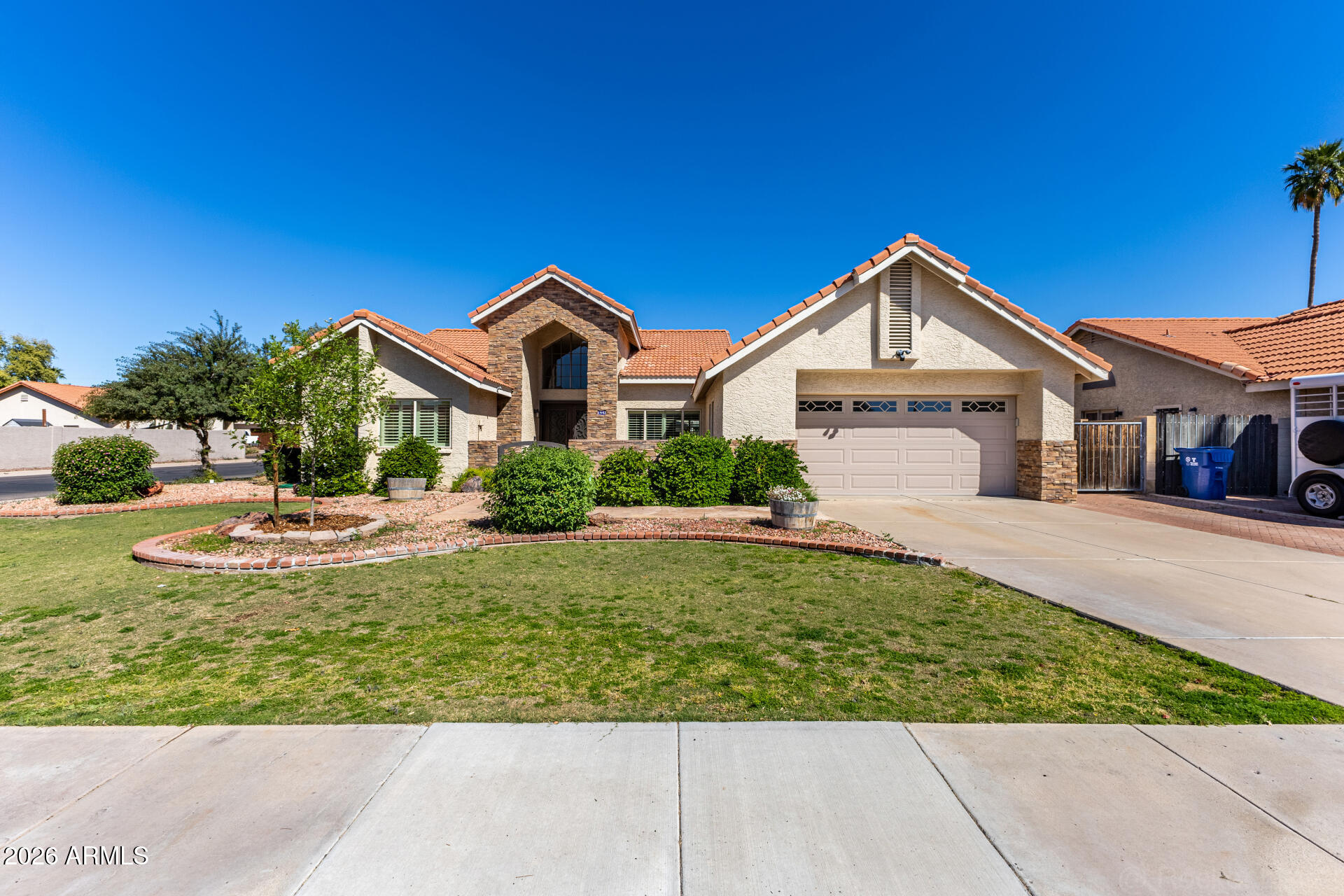 1942 East Krista Way Tempe, AZ 85284 - Photo 43 of 51 a front view of a house with a yard
