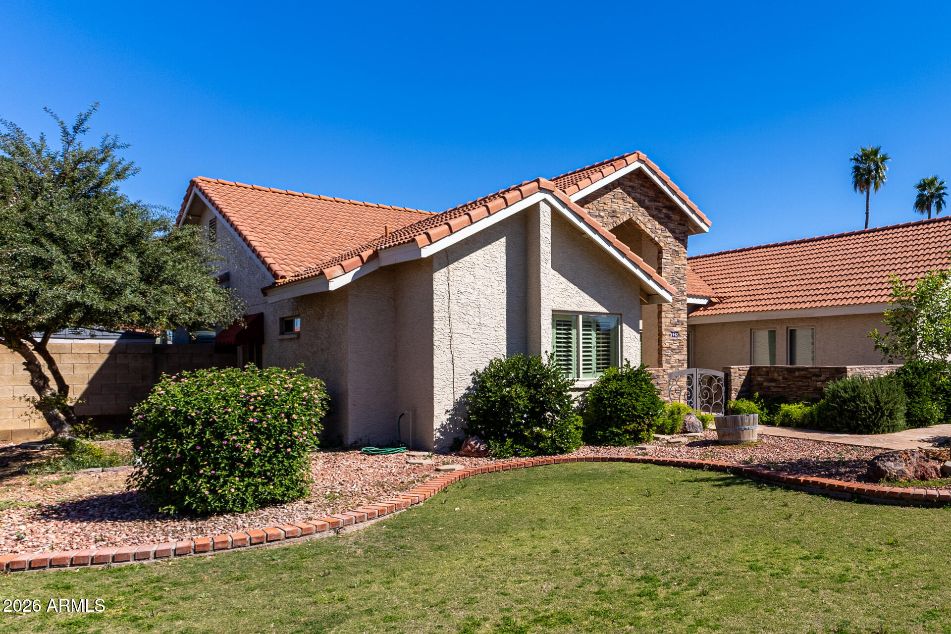 1942 East Krista Way Tempe, AZ 85284 - Photo 44 of 51 a front view of a house with a yard