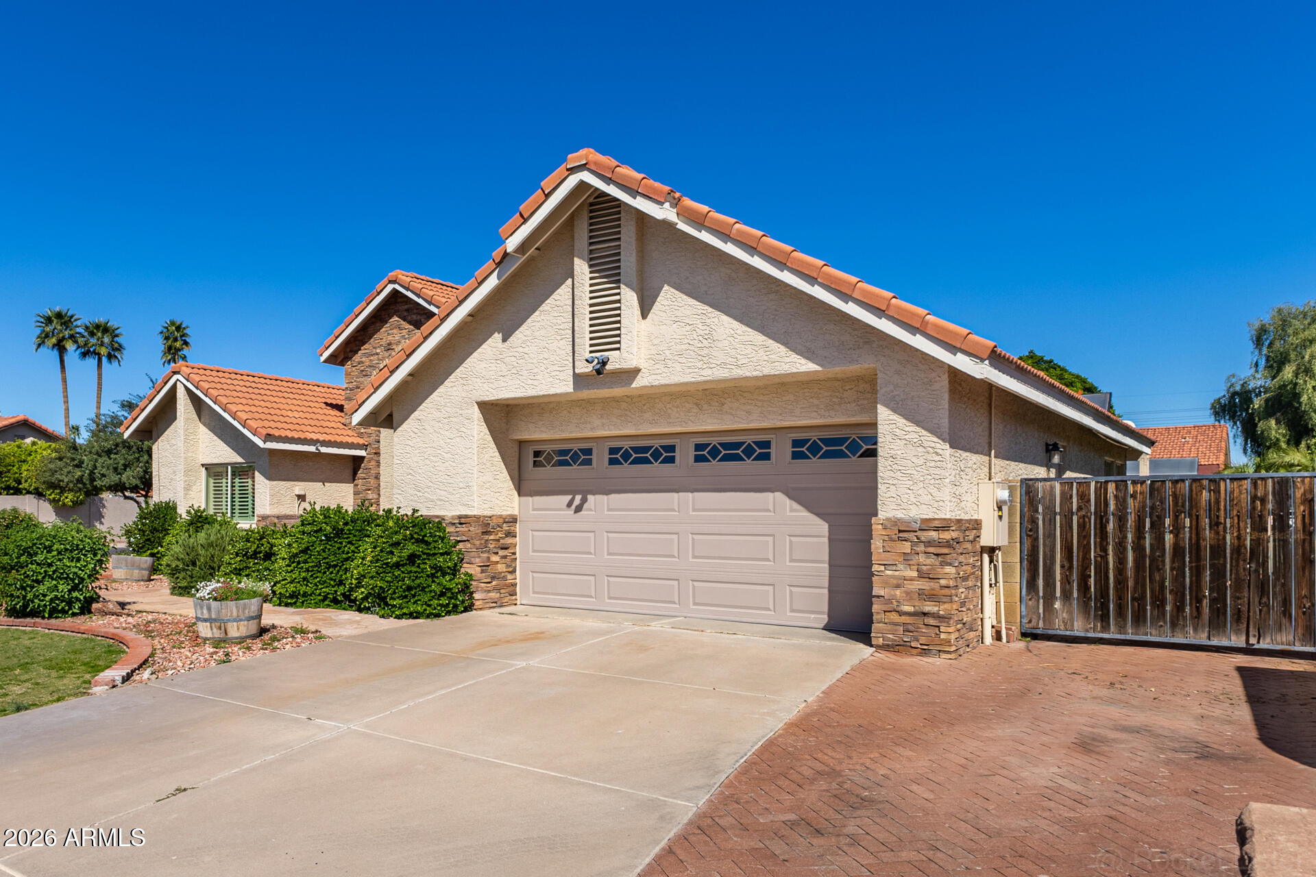 1942 East Krista Way Tempe, AZ 85284 - Photo 46 of 51 a front view of a house with a garage