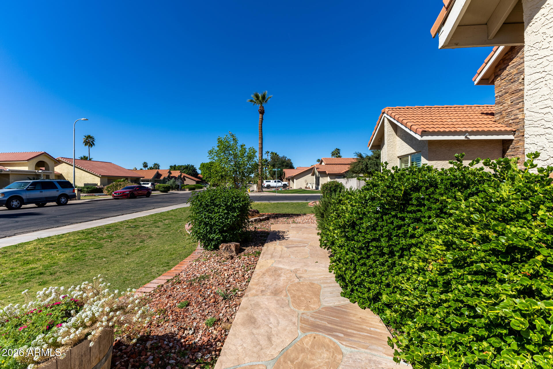 1942 East Krista Way Tempe, AZ 85284 - Photo 48 of 51 a view of a garden with cars parked