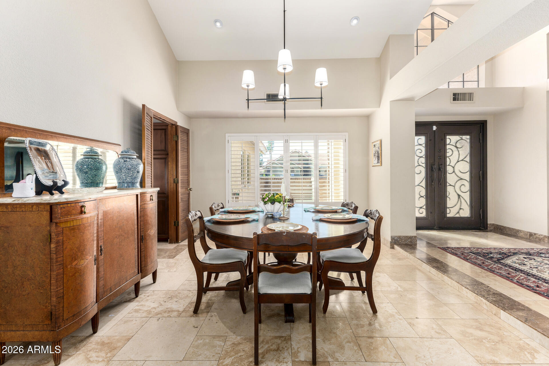 1942 East Krista Way Tempe, AZ 85284 - Photo 5 of 51 a dining room with furniture a chandelier and window